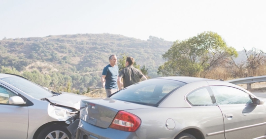 two people arguing after car accident