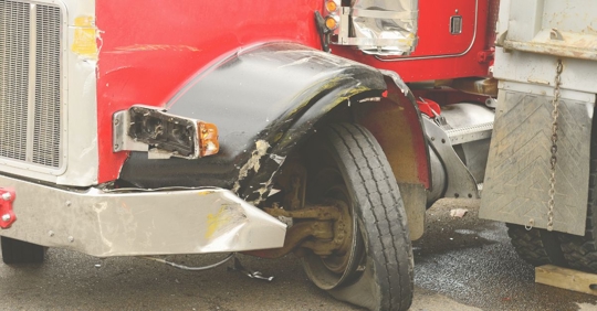 a truck with a blown out tire
