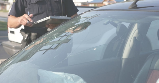 police officer writing accident report