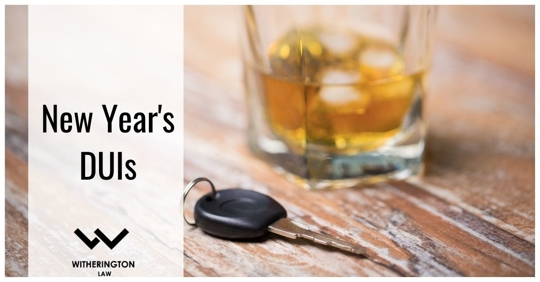 cup of liquid and key on table