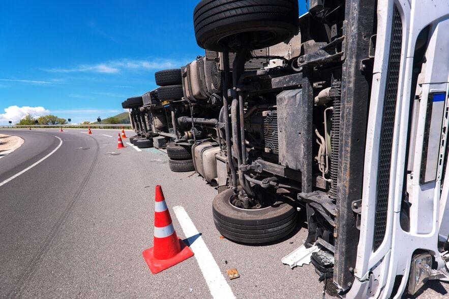 Truck laying on its side after a rollover accident